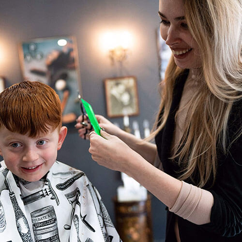 Little boy getting a haircut